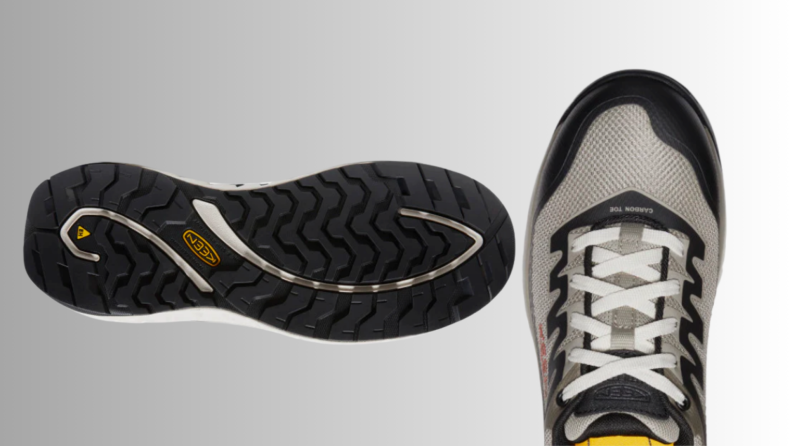 A workboot and its sole on a light gray background