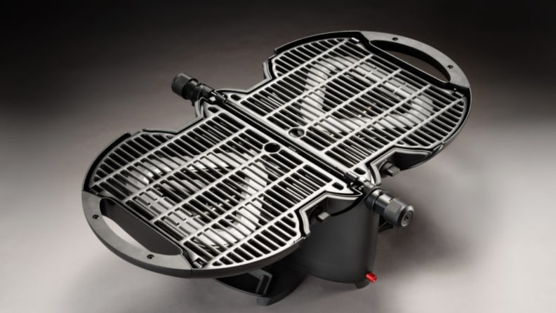 A NomadiQ gas propane grill with its two sides open.