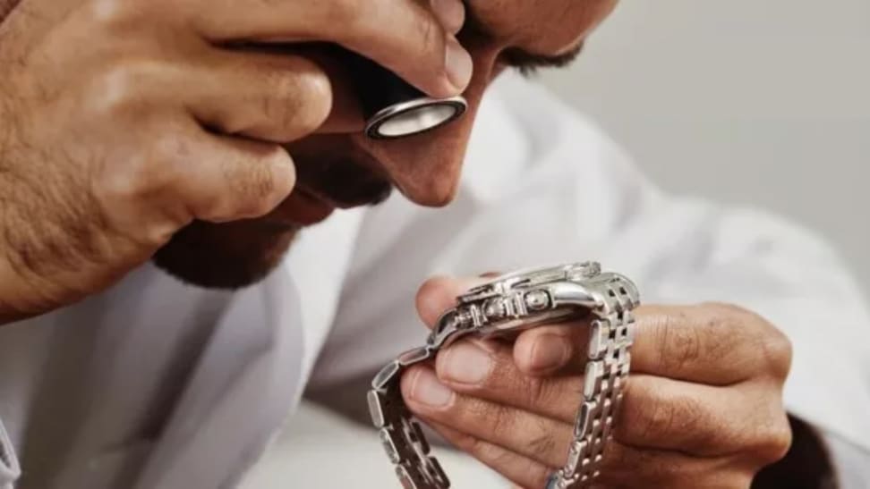 Man inspecting watch