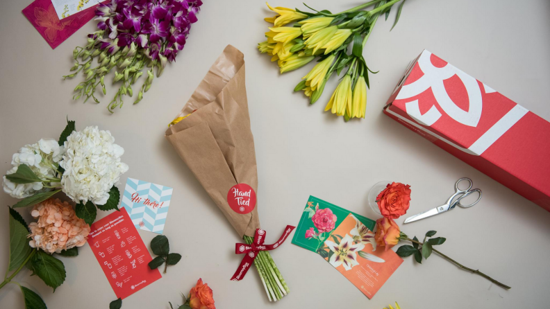 BloomsyBox bouquet surrounded by flowers