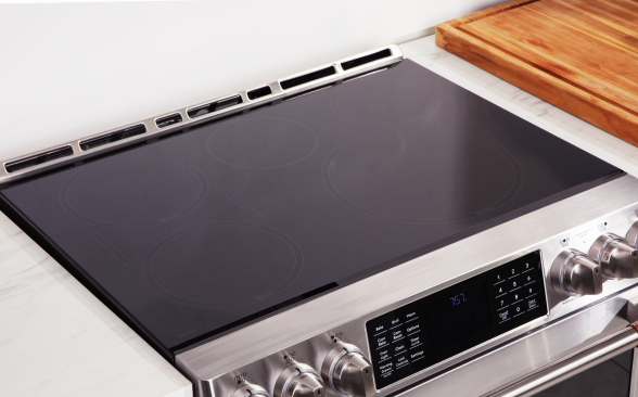 Close-up of the cooktop on a stainless steel induction range.