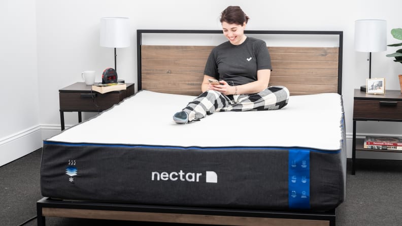 woman reading on bed with nectar mattress