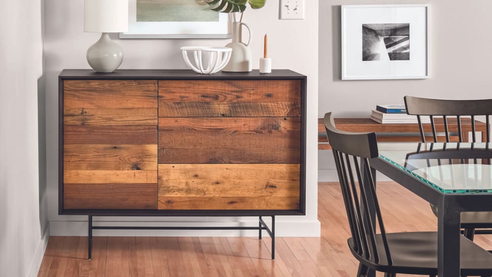 McKean media cabinet sitting in dining room with bowl and candlestick on top.