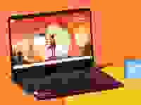 The Lenovo IdeaPad Game 3 on an orange background.