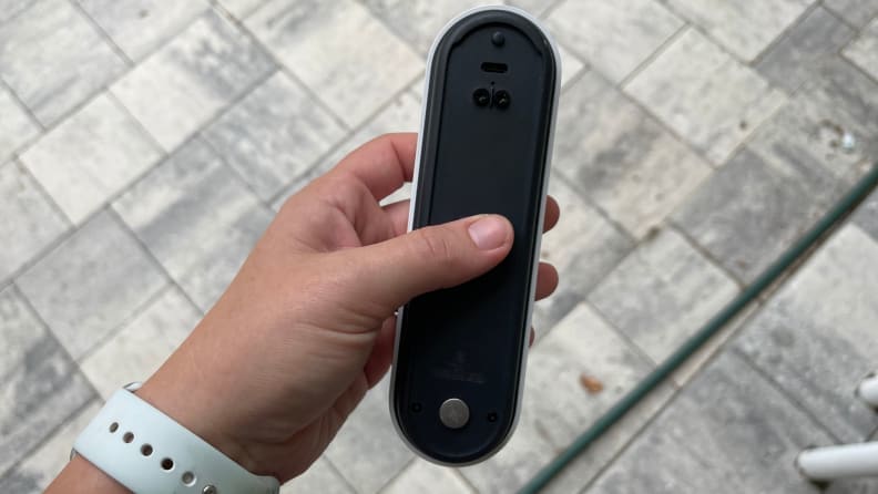 Holding the Nest Doorbell in one's hand
