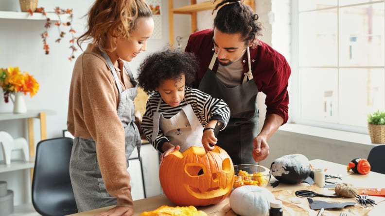 Family carving pumpkin