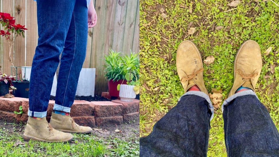 Man wearing a pair of Clarks Desert Boots in his backyard, in the discontinued color of distressed teak.