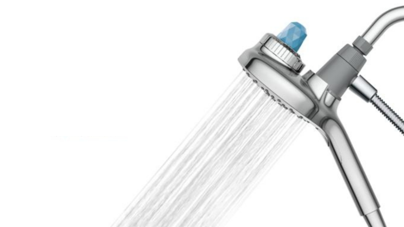 A Moen showerhead squirts water.