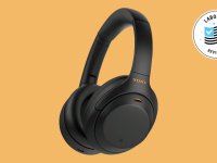 Sony WH-1000XM4 wireless headphones appear over a Reviewed background.