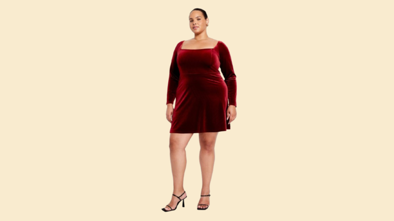 A model wearing a red midi dress.