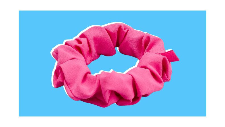 Hot pink Lululemon Uplifting Scrunchie in "Sonic Pink" shade.