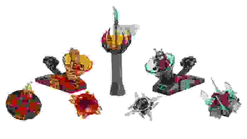 Two buildable Ninjago Spinjizu spinners and a Forbidden Scroll