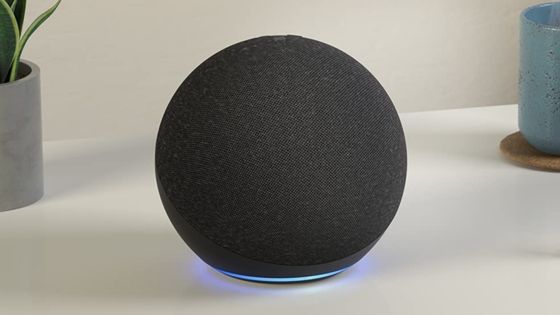 A black Amazon Echo sits on a counter.