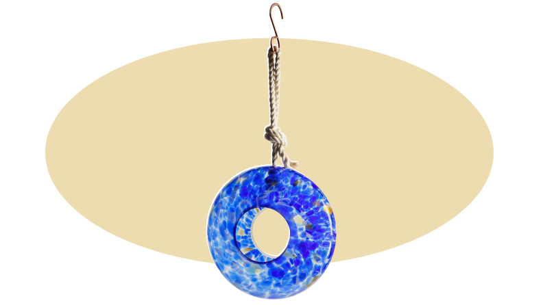 Product shot of blue handmade Glass Bird Feeder.