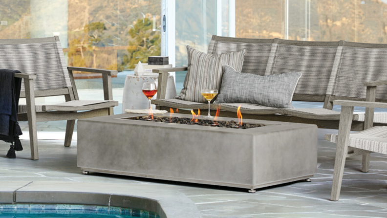 For an upscale fire feature, try Arhaus' rectangular, light gray concrete, outdoor fire table. It can be yours for about a grand.