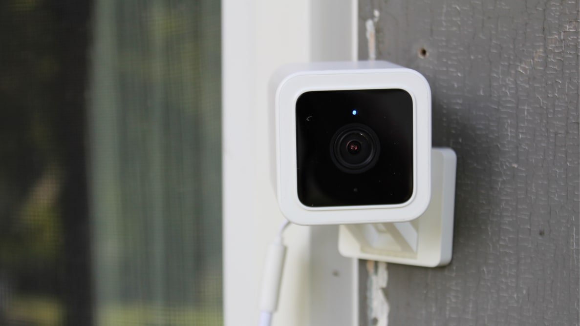 Wyze Cam V3 security camera mounted on wall outdoors.