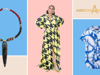 A necklace with a long central bead, a yellow houndstooth dress, a gold initial ring, and a blue dyed shirt.