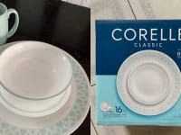 On left, four piece white and pastel blue set of Corelle dishes. On right, Corelle original packaging for 16-piece dinnerware set.