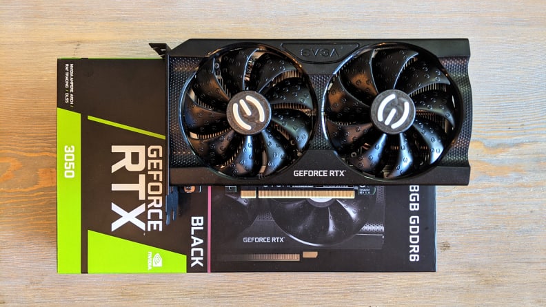 Top down view of a GPU on top of its packaging box