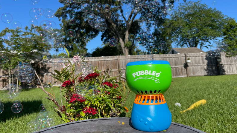 The Fubbles Fun-Finiti Bubble Machine blowing bubbles outside