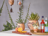 Trays, rain chains, and potted plants are great outdoor bar ideas