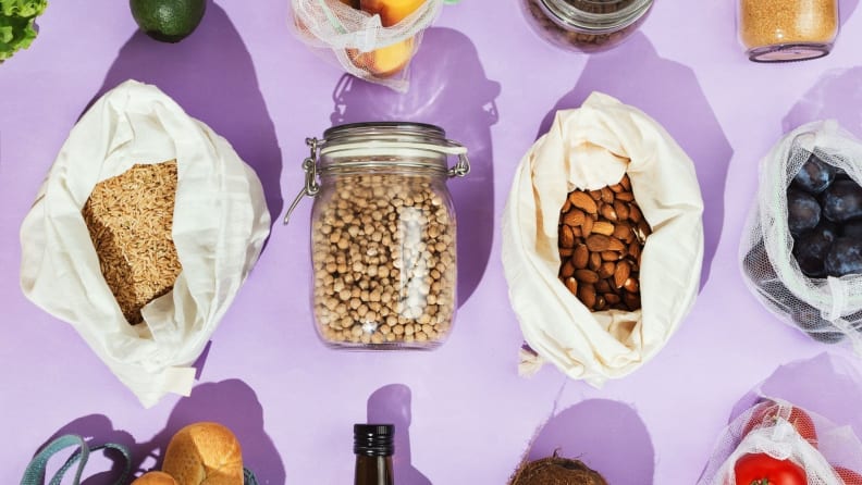 An assortment of pantry goods are neatly assembled on a surface.