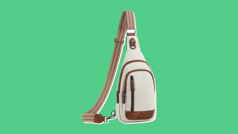 A front view of the CLUCI sling bag in beige with brown accents.