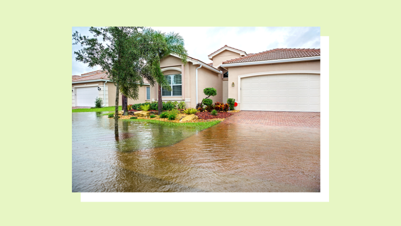 Exterior of residential surrounded by flood water.