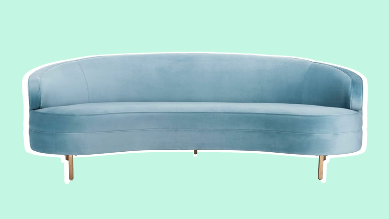 Curved, pastel blue velvet couch.