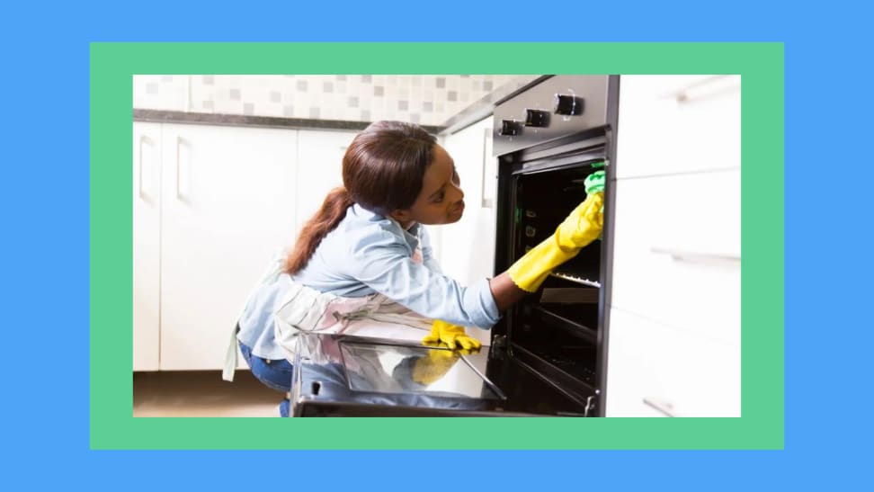 A woman cleaning her oven