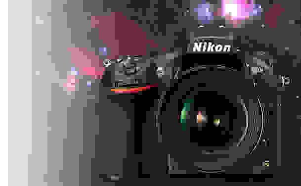 The Nikon D810 over a shot of nebulae taken with the camera.