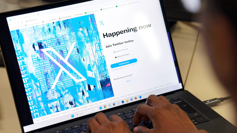 Photograph of a laptop screen showing the login screen for Twitter’s rebrand to X.