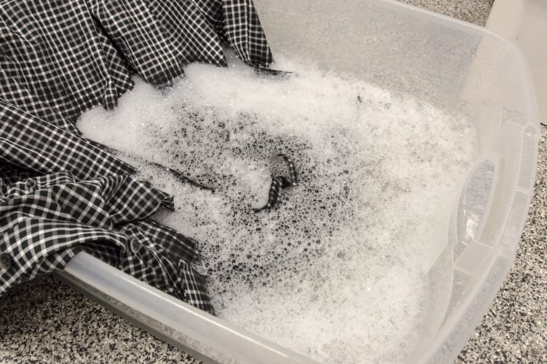 Soak in cold water to get rid of the excess detergent and help lift the stain.