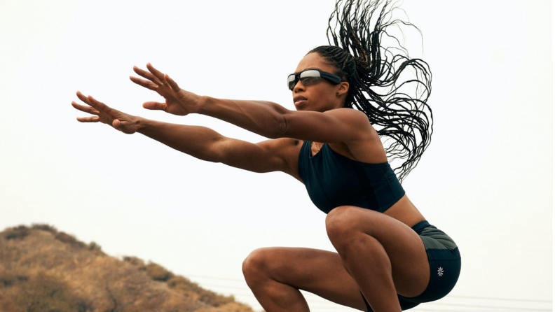 Person exercising outdoors while wearing sunglasses.