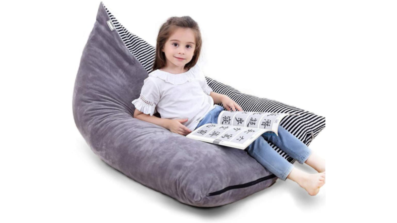 A child sits on a bean bag chair.