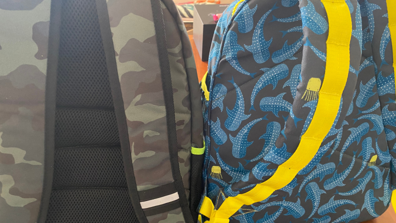 Two backpacks back to back for comparison.