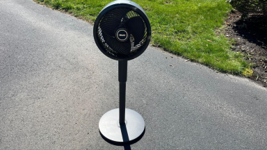 An outdoor view of the Shark FlexBreeze fan in pedestal mode.