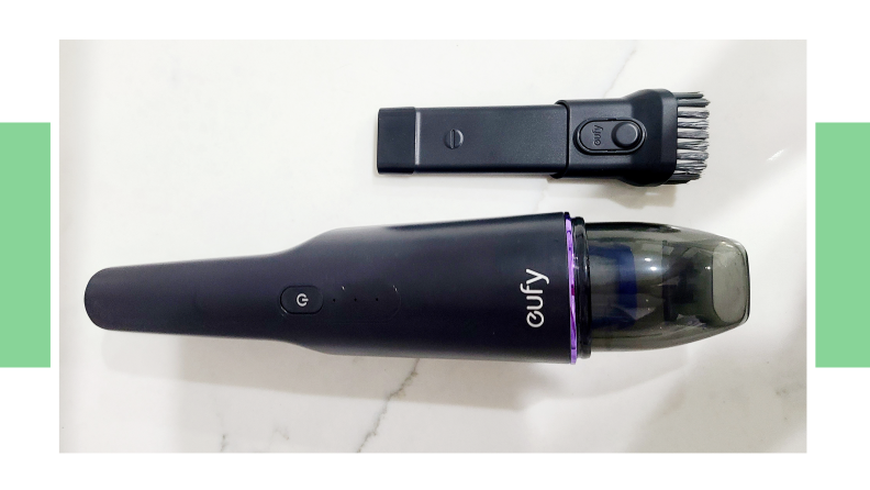 The Eufy Handheld Cordless Vacuum with the brush attachment.