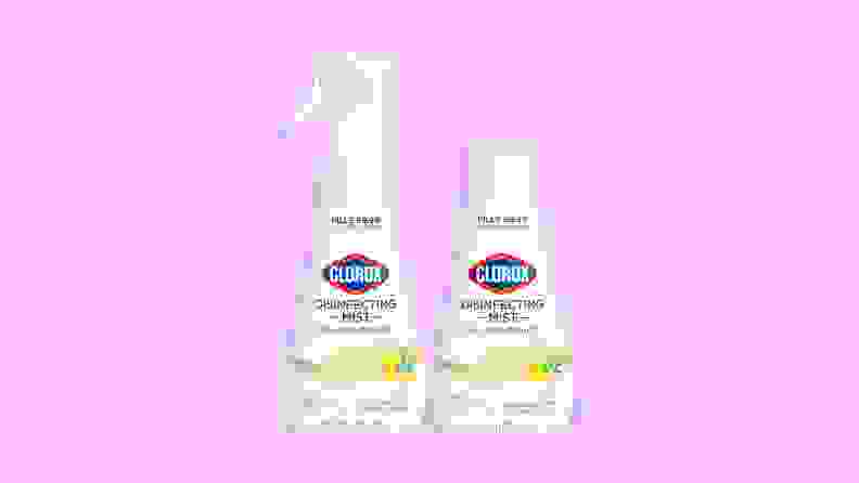 Two white bottles of Clorox Disinfecting Mist standing side by side on a purple background.