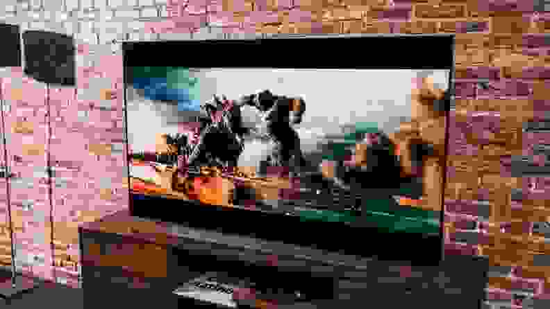 Flatscreen TV showing fight with a giant gorilla