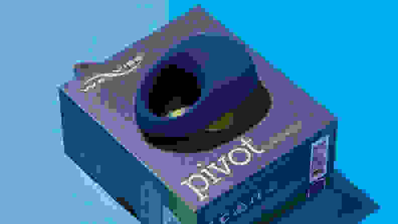 A blue We-Vibe Pivot vibrating cock ring on top of cardboard box.