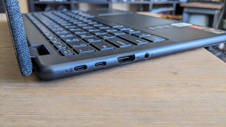 A profile view of an open Lenovo Yoga 6 laptop, showing a close-up of the denim lid.