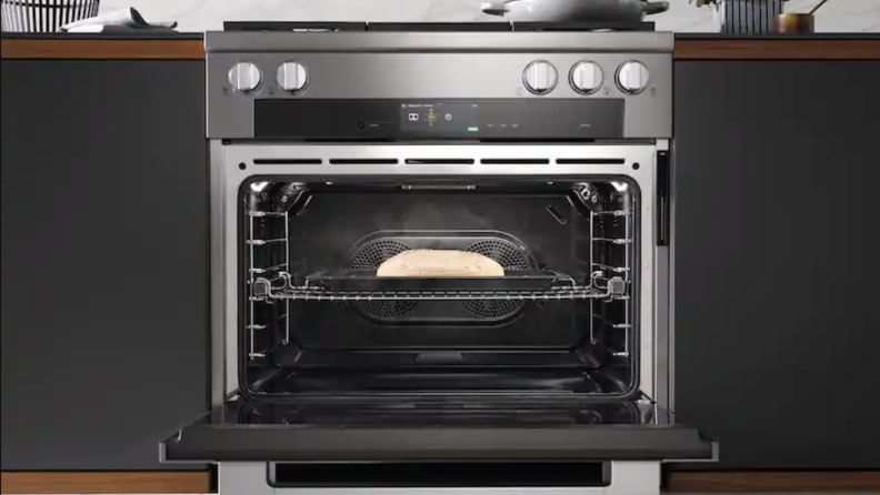 A range sits in cabinetry in a kitchen setting