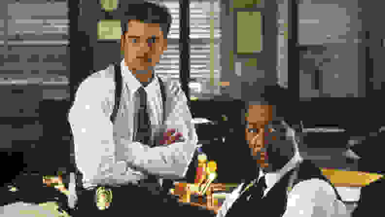 Brad Pitt and Morgan Freeman in a scene from "Seven," one of the best thrillers streaming now.