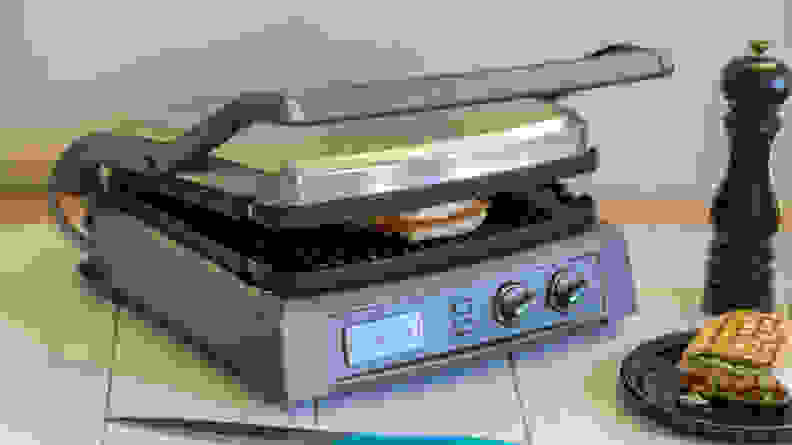 A silver Cuisinart Griddler Deluxe viewed from a front right angle.