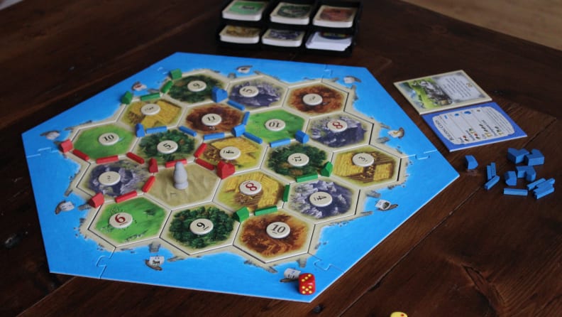 Catan is a German-style board game that's played with three or four people.