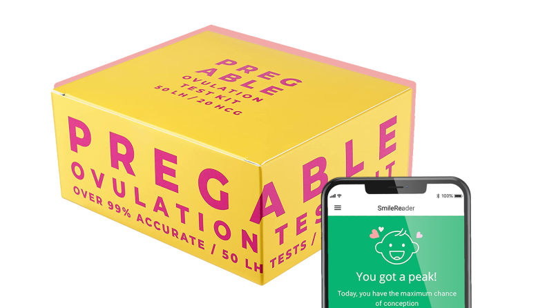 Box of Pregable ovulation tests next to smart phone that displays compatible phone application.