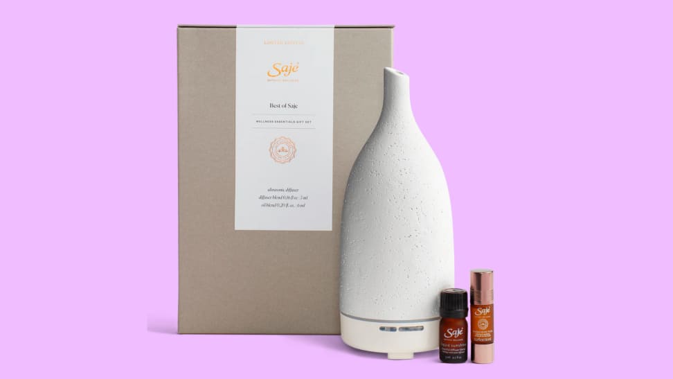 An image of the Saje 'Best of Saje' collection featuring two essential oil bottles and a Saje Aroma Om diffuser in white.