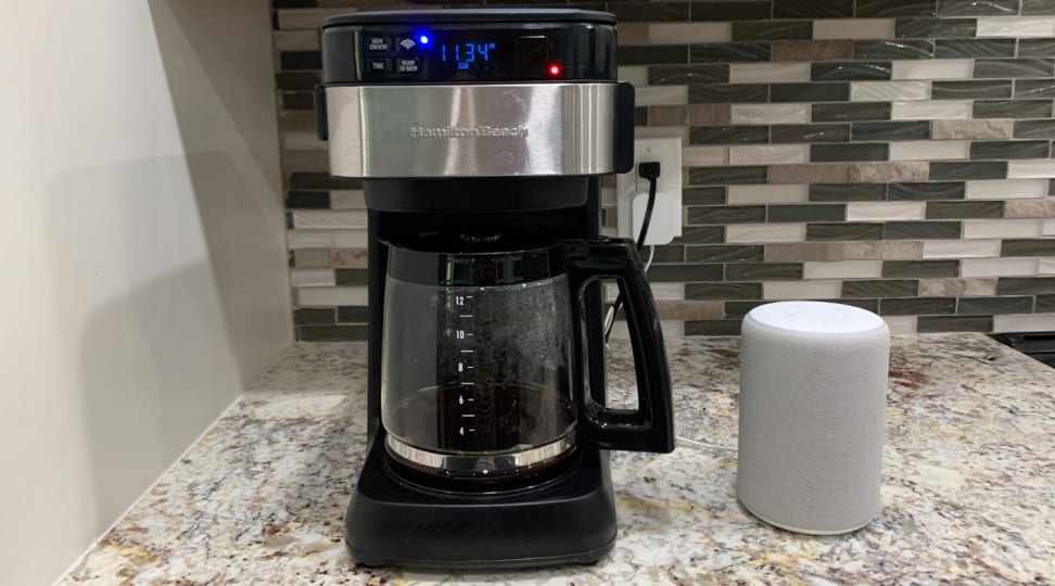 Hamilton Beach's smart coffee maker sits next to an Amazon Echo speaker on the kitchen counter.