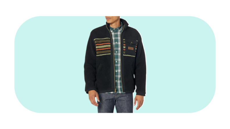 A model wearing a fleece jacket with a multi-colored stripe print.